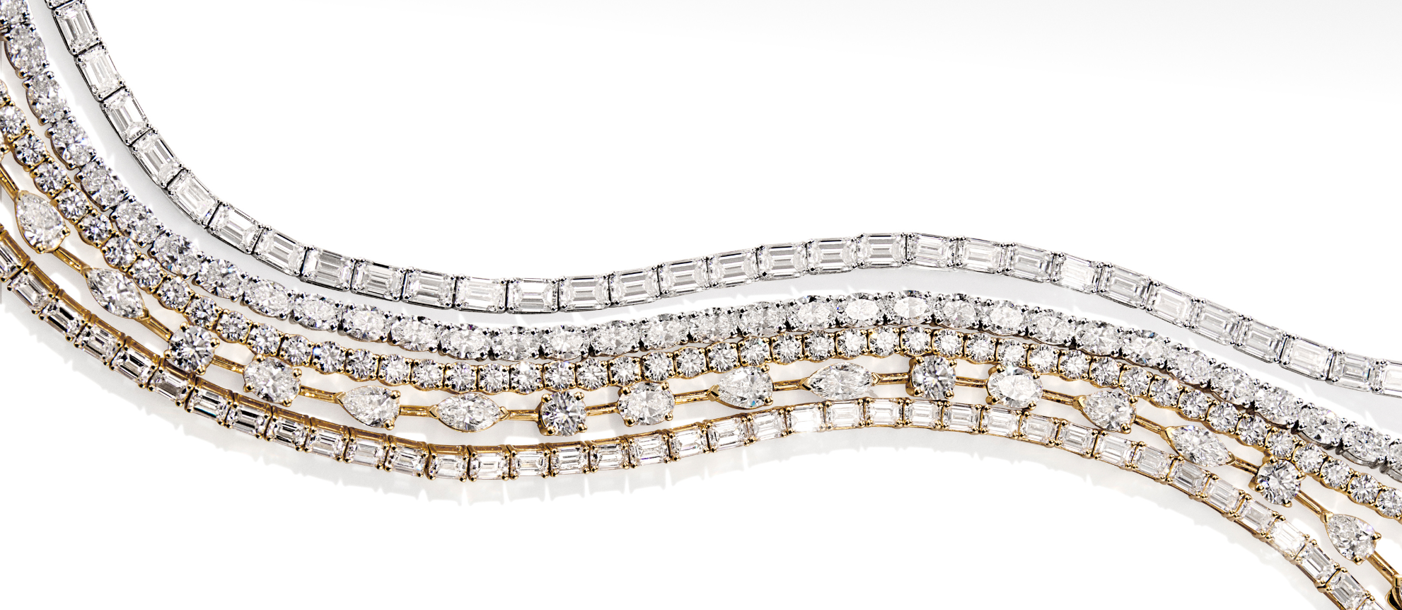 Diamond necklace with gold and white gold elements on a white background