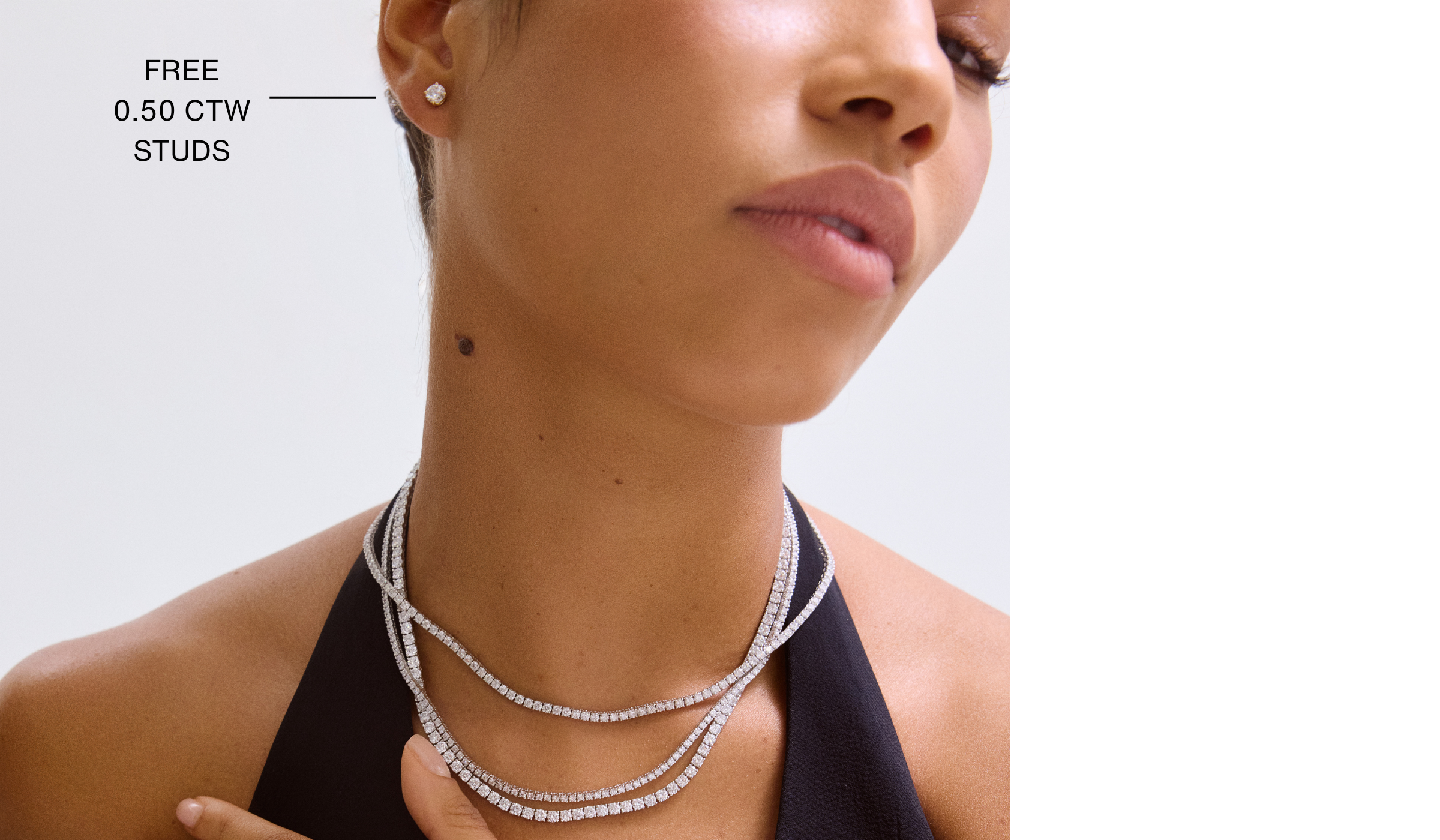 Close-up of a woman wearing layered necklaces with text indicating free stud earrings.